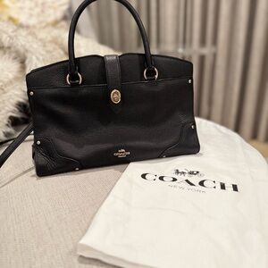 Coach handbag with original dust cover.